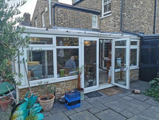 Extension Kitz - Before image of a large old conservatory