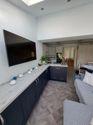 limited access home extension long shot kitchen with tv