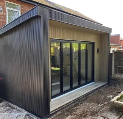 Clad bi-fold extension