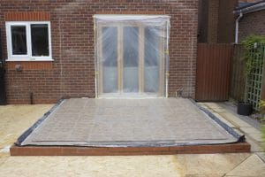 base with damp proof membrane, underfloor insulation, and steel mesh ready for concrete to be poured on top.